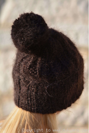 Chunky winter ski hat with pompon knitted in chocolate brown