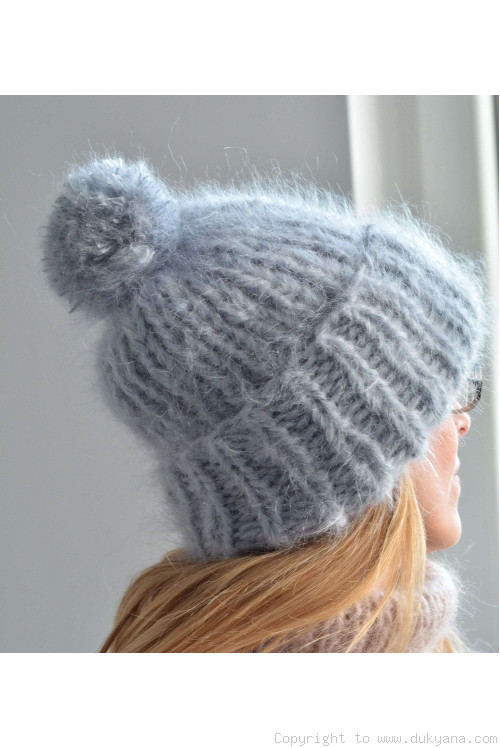 Chunky winter ski hat with pompon knitted in light gray