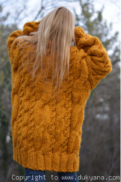 Oversized chunky cabled wool sweater in mustard yellow