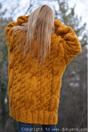 Oversized chunky cabled wool sweater in mustard yellow