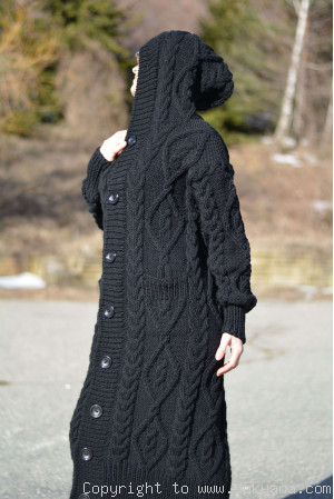 Merino blend hooded cabled cardigan knitted in black