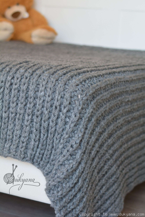 Hand knitted chunky machine washable wool blanket