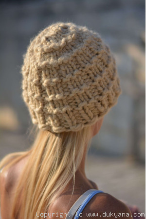 Warm and soft knitted beanie in camel beige
